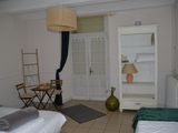 a bedroom with two beds and a table with a chair