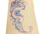 a drawing of a seahorse on a piece of paper