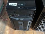 two computers sitting on top of each other on the floor