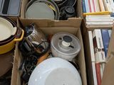 a box full of assorted kitchen items on the floor