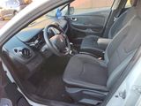 the interior of a car with the door open and the steering wheel down