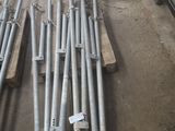 a lot of metal pipes that are sitting on the ground