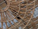 a wicker basket hanging from the ceiling of a store
