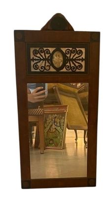 a person taking a picture of themselves in a mirror