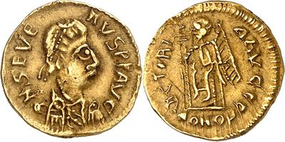 a gold coin with an image of a man on it