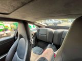 a picture of a view of the inside of a car from the driver ' s seat