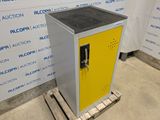 an image of a metal cabinet sitting on a pallet in front of a wall