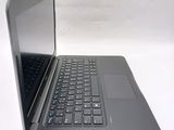 an open laptop computer sitting on top of a white table