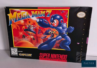 La boîte du jeu « Mega Manz » est posée sur une table.