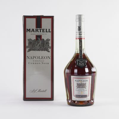 a close up of a bottle of wine next to a box