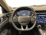 the interior of a car with a steering wheel and dashboard