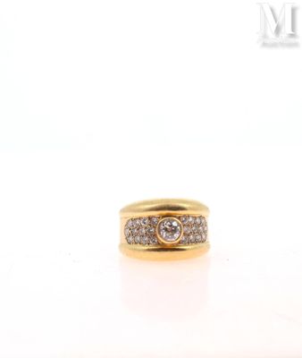 a close up of a diamond ring on a white surface
