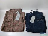 two pairs of women ' s pants with tags on them