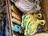 a box full of teapots and other decorative items