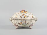an image of a porcelain covered dish with animals on it