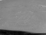 black and white photograph of a glass plate with a bowl on it