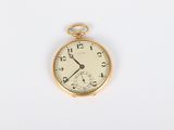 an antique pocket watch on a white surface with a white background