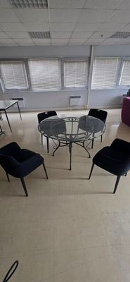 a room with a table and chairs in it