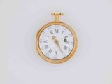 a gold pocket watch with roman numerals on the face