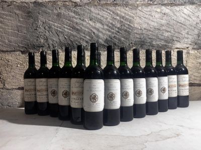 bottles of wine lined up in a row on a table
