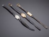 three ladies ' s wrist watches with diamonds and a gold clasp