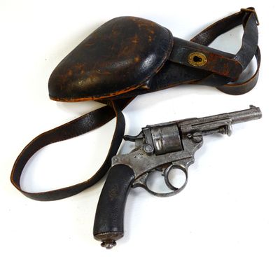 an old gun and a hat on a white surface