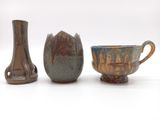 three different types of vases on a white surface