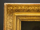 painting of a man with a beard in a gold frame on a black background