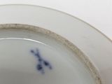 a white plate with a blue and white design on it