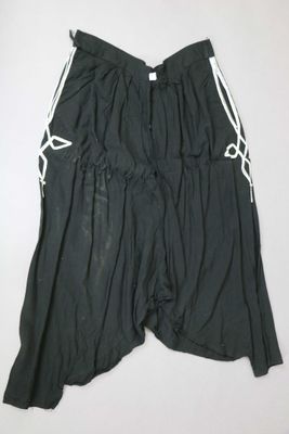 the shorts are black and white with a white stripe on the side