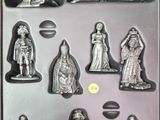a chocolate pan with a variety of figurines in it