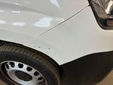 a close up of a white car with a black stripe on it