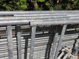a metal fence that has a bunch of rust on it