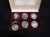 an image of a set of six silver coins in a box