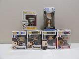 tout un tas de figurines Pop Vinyl différentes sur la table