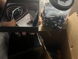 a person holding a box with a pair of shoes in it