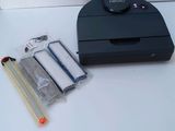 a photo of a printer and a stapler on a table