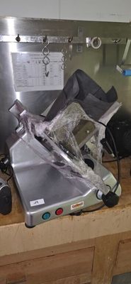 a silver machine that is sitting on top of a counter