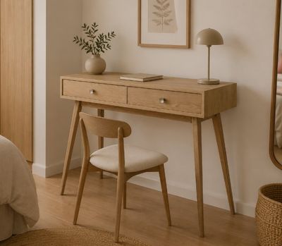 a desk with a mirror and a chair in a bedroom