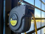 a yellow hose attached to the side of a bus