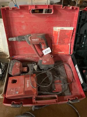 a red tool box with tools in it on the floor
