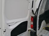 a white van with its door open on the side of the road
