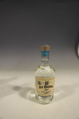 a small bottle of alcohol sitting on a table