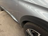 a close up of a car parked in a parking lot