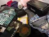 a pile of clothing and other items on the floor