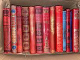 a box full of books that are sitting on the floor