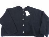 a close up of a black sweater with a tag on it