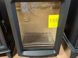 a stove that has a glass door on top of it