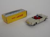 a toy car and a box on a white surface