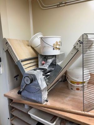 a machine that is sitting on top of a wooden table